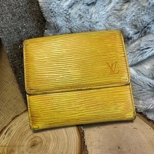Louis Vuitton Epi Trifold Wallet in Yellow Gold. $165